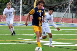 Luke Caputo/Kitsap News Group photos
Spartan August Peterson dribbles the ball in a 12-0 Bainbridge home win over Sequim in 2A district play May 13.