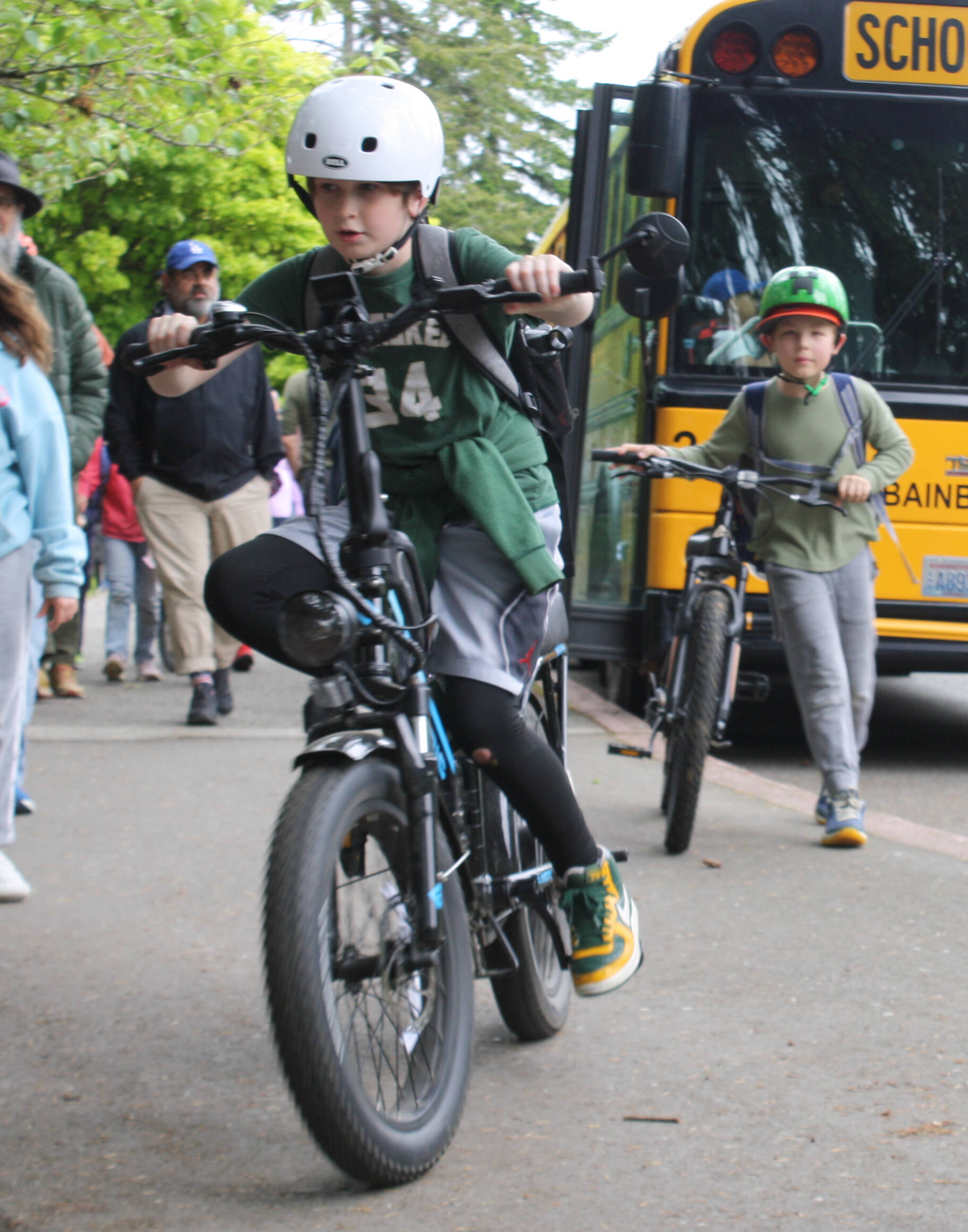 Ordway student Owen Leedle, front, and Jonathan Reiher, back, bike home from school May 16.