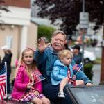 Bremerton Mayor Greg Wheeler, a Navy veteran, waves to the crowd during the Armed Forces Day Parade May 17.