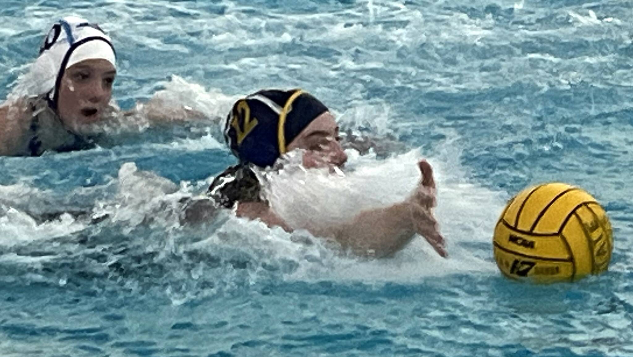 Spartan Cate Everett reaches for the ball in a Bainbridge state win over Rogers May 29.