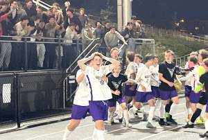 Luke Caputo/Kitsap News Group photos
Viking Harper Sabari (front) celebrates NKs 2-1 penalty kick win over the Bainbridge Spartans in the semifinals of the 2A state boys soccer tournament at Federal Way Memorial Stadium May 30.