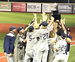 Luke Caputo/Kitsap News Group photos
The Spartans hold the state trophy high after a 3-0 win over top-seed Anacortes in the championship game May 31 in Bellingham.