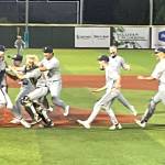 The Bainbridge Spartans storm the field in celebration May 31 at Joe Martin Stadium in Bellingham following the final out of the game that secured the schools first state baseball title.