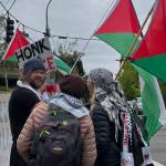Protesters talk outside of BIMA during the demonstration.