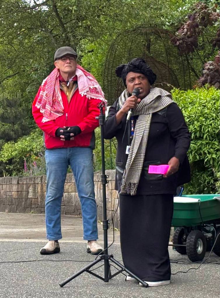 Akuyea Karen Vargas, founder of Kitsaps Equity, Race and Community Engagement Coalition (ERACE), speaks in support of the protesters during the demonstration.