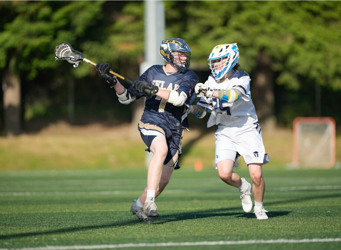 Spartan Dylan Jones plays tight defense in a 23-5 Bainbridge win over Selah in the 2A lacrosse state championship game at Starfire Stadium in Tukwila May 24.