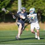 Spartan Dylan Jones plays tight defense in a 23-5 Bainbridge win over Selah in the 2A lacrosse state championship game at Starfire Stadium in Tukwila May 24.