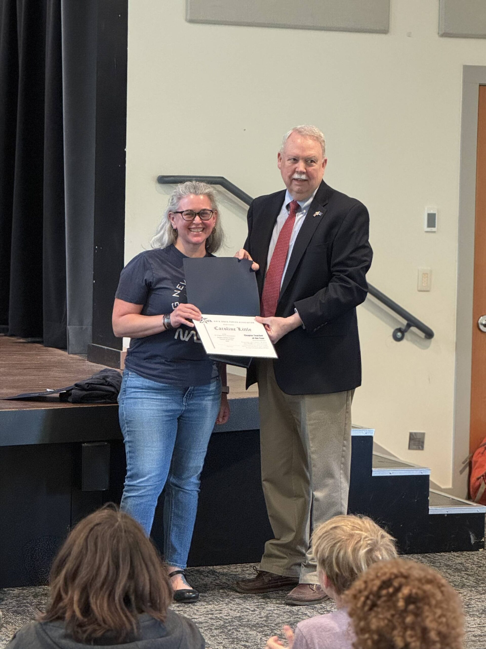 Little receives the award from AFA Greater Seattle Chapter vice president Rick Sine.