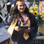 Sofia Peato smiles with her diploma.