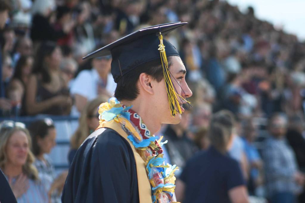 Nelson Wynne walks to take his seat at the graduation ceremony.