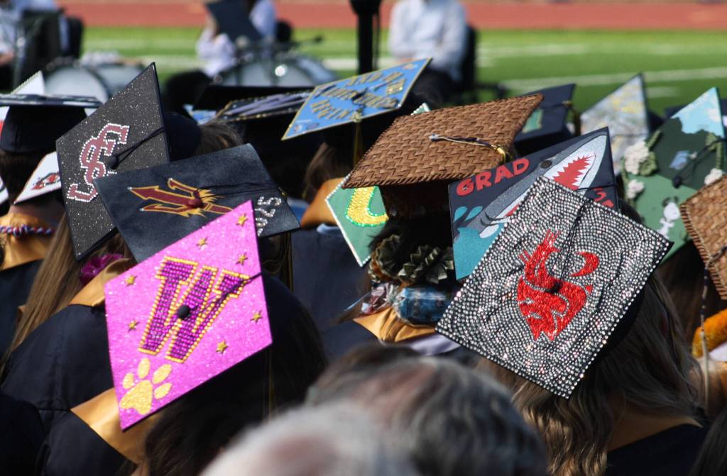 Students donned decorated caps that highlighted their college and career plans.