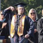 Graduate Cameron Tyler poses with his diploma.