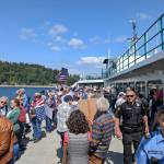 Hundreds of protesters boarded the 10:25 a.m. Bainbridge to Seattle ferry.