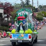 Frog Rock takes a ride down Winslow Way for the 4th of July parade.