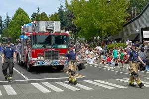 BI Chamber of Commerce courtesy photos
The Bainbridge Island Fire Department strolls down Winslow Way for the Grand Old 4th of July Parade.