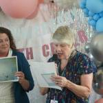 VMFH courtesy photos
Former nurse Julie Harper (center) reads a poem she wrote titled Labor Room Walls at an event honoring the 25th anniversary of St. Michael Medical Centers Family Birth Center July 8.