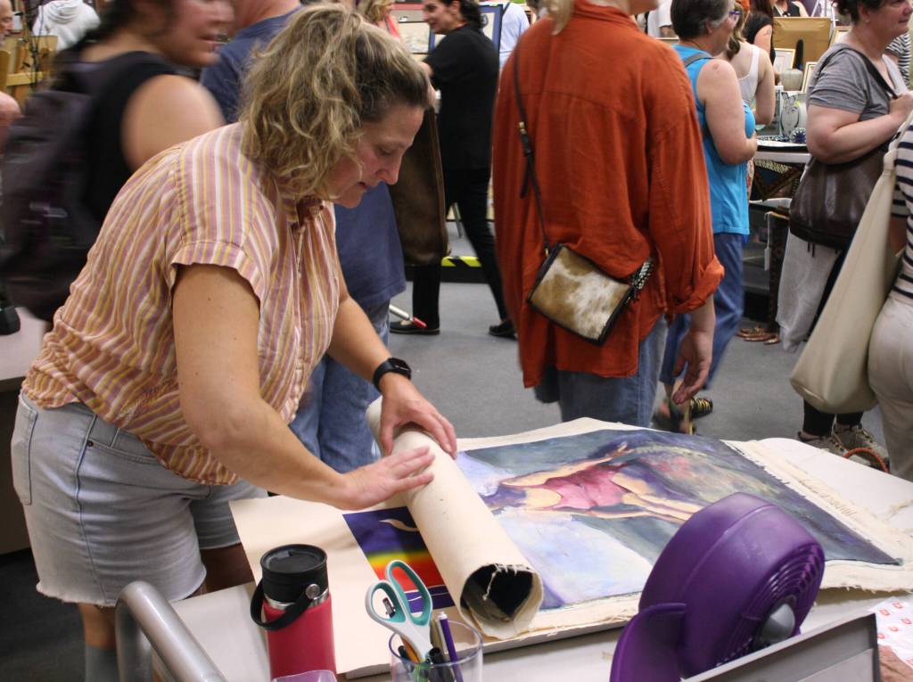 The fine art sale and auction draws many a keen eye.