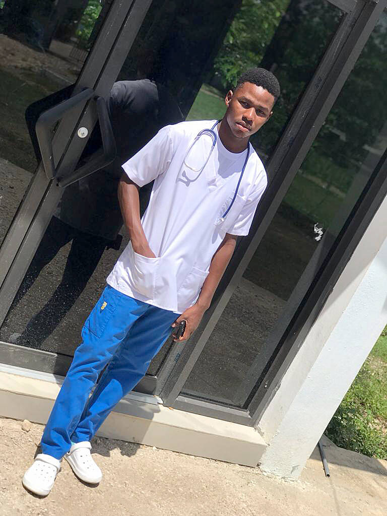 Jean Mozard, a graduate of the Flower of Hope Middle School, is starting his third year in medical school.