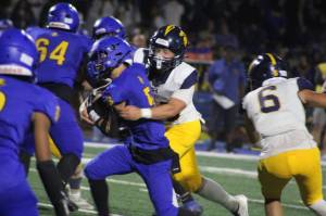 Luke Caputo/Kitsap News Group photos
Bainbridge Spartan Zack Ausmeier wraps up Knight Kenneth Najera in a 41-14 Bremerton home win Sept. 19.