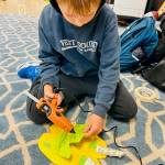 3rd and 4th-grade students explore paper art.