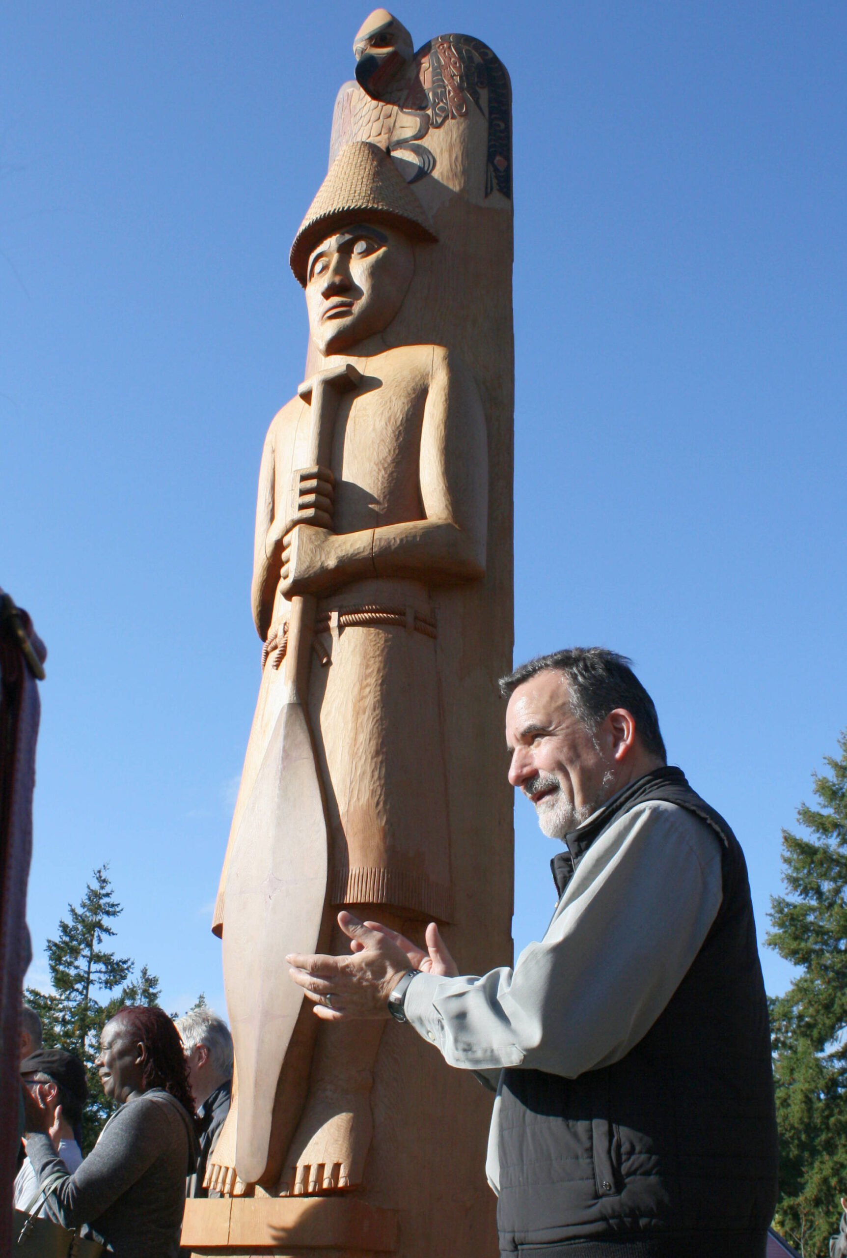 Suquamish Tribe Chairman Leonard Forsman celebrates the unveiling of Schweabe, the historic Suquamish chief depicted on the Welcome Pole at the entrance of the Sound to Olympics Trail on Bainbridge Island.