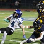 Spartan defender Theodore Wilson brings down North Mason WR Remi McFarlane with Spartan defensive back Heath Voegtlin looking on in a 28-14 Bainbridge home loss to the Bulldogs Oct. 4.