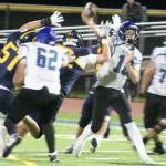 Luke Caputo/Kitsap News Group photos
Spartan defensive linemen Wyndham Kocenash and Kincaid Hopp attempt to bring down North Mason QB Danner Jones in a 28-14 Bainbridge home loss to the Bulldogs Oct. 4.
