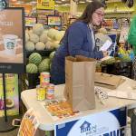 Rose Untalaseo volunteers with the Everybody Eats Food Drive.