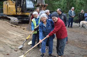 Ellen Sato Faust courtesy photo
Frances Ikegami (left) and her sister, Lilly Kodama (right), both survivors of incarceration during WWII, dig their shovels into the dirt to signify the groundbreaking for the Bainbridge Island Japanese American Exclusion Memorial Visitor Center Oct. 11.