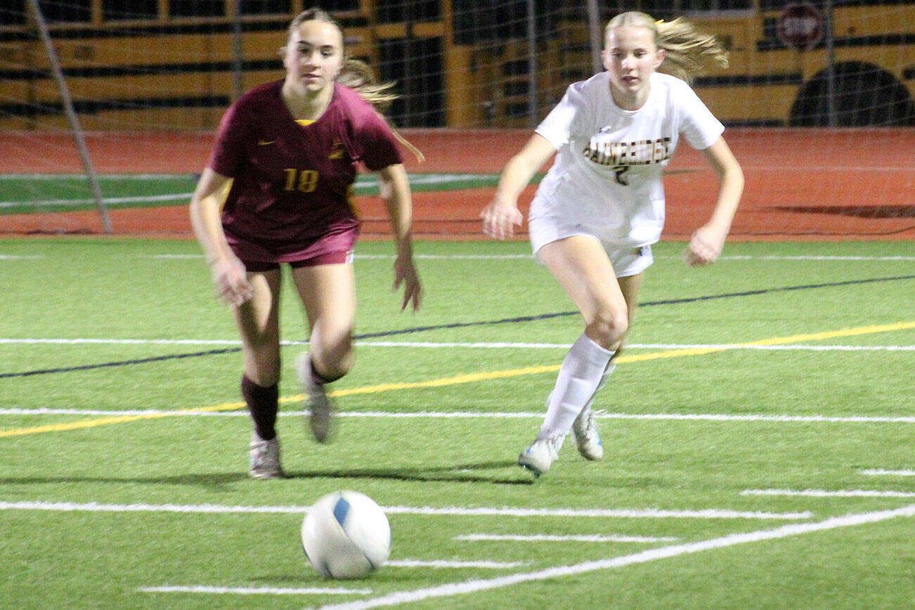Buccaneeer Catherine Prescott and Spartan Magda Rufo-Hill go after the ball in a 6-0 Bainbridge road win over Kingston Oct. 21.
