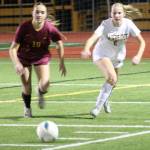 Buccaneeer Catherine Prescott and Spartan Magda Rufo-Hill go after the ball in a 6-0 Bainbridge road win over Kingston Oct. 21.