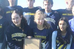 Luke Caputo/Kitsap News Group photos
Members of the Bainbridge cross country team celebrate their first-place finish in both the boys and girls competition at the 2025 district cross country championships Nov. 1 in Tacoma.
