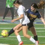 Luke Caputo/Kitsap News Group photos
Spartan Abril Edwards fights for the ball with an Anacortes player in a 4-3 Bainbridge home loss to the Anacortes Seahawks in the quarterfinals of the 2A girls state soccer tournament Nov. 15.