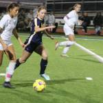 Spartan Eliza Jurcak keeps up with a Selah player in a 1-0 home win over the Selah Vikings Nov. 12 in the first round of the 2A state tournament.