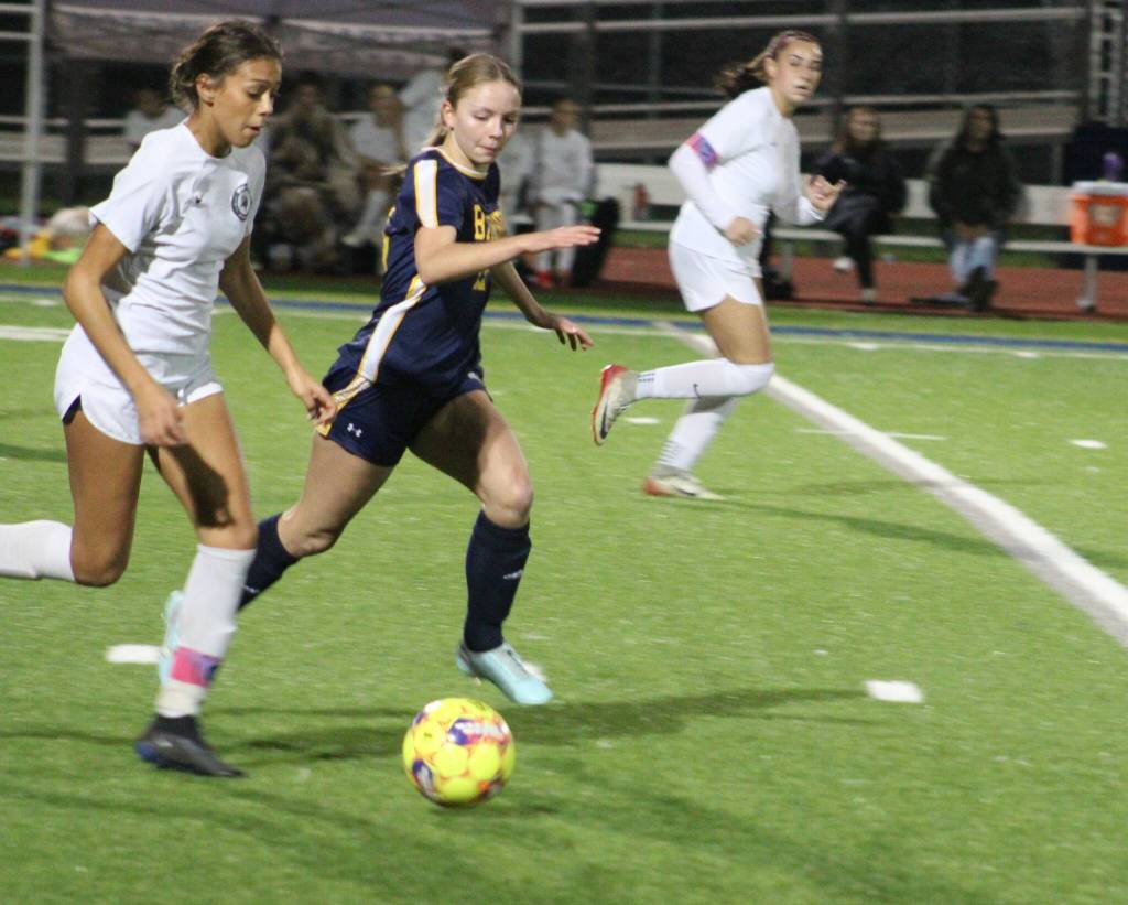 Spartan Eliza Jurcak keeps up with a Selah player in a 1-0 home win over the Selah Vikings Nov. 12 in the first round of the 2A state tournament.
