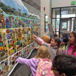 Diane Bonciolini courtesy photos
Students at Summitview Elementary in Yakima take a look at their finished work in the mural they created with Mesolini Glass Studios.