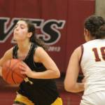 Luke Caputo/Kitsap News Group photos
Spartan Elsa Drugge looks to make a pass in a 54-24 Bainbridge win over the South Kitsap Wolves Dec. 15 in Port Orchard.