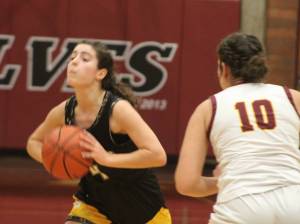 Luke Caputo/Kitsap News Group photos
Spartan Elsa Drugge looks to make a pass in a 54-24 Bainbridge win over the South Kitsap Wolves Dec. 15 in Port Orchard.
