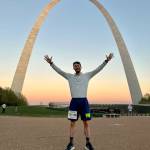 Nance poses in front of the Gateway Arch in St. Louis, a monument to U.S. expansion and a symbolic dividing line between the East and West parts of the country.
