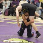 Bainbridge Spartan Omid Neghabat lifts Viking Isaac Powell during a Jan. 22 wrestling meet at North Kitsap High School.