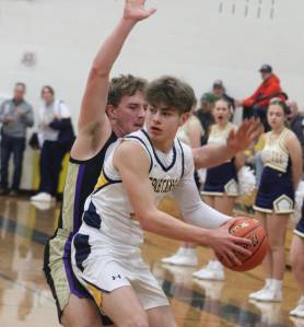 Luke Caputo/Kitsap News Group photos
Spartan Leo Koch looks to pass the ball in a 55-42 Bainbridge home win over Sequim Jan. 23.