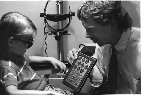 Dr. Kirscher conducts a stereopsis test to see how well the two eyes work together.