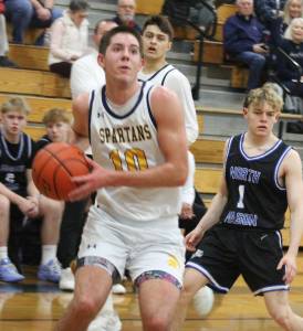 Luke Caputo/Kitsap News Group	
Spartan Ryan Rohrbacher drives to the hoop in a 76-52 senior night win over North Mason Feb. 3 at Bainbridge High School.