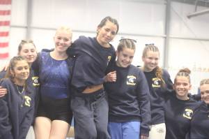 Luke Caputo/Kitsap News Group photos
The Bainbridge Spartans celebrate their first-place finish at the district gymnastics meet Feb. 6 at Black Hills Gymnastics in Lacey.