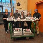 Will Grant courtesy photos
Will Grant dropped off 60 pizzas at Marys Place in South Lake Union Feb. 9, seen here with shelter staff.