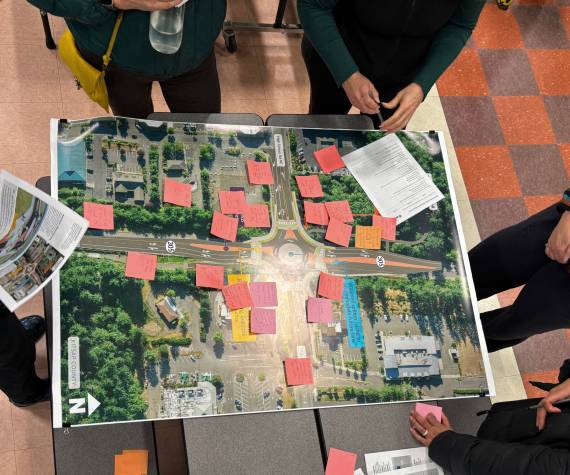 <p>Molly Hetherwick/Kitsap News Group</p>
                                <p>Community members discuss a proposed roundabout project at the intersection of Hwy 305 and High School Road during an open house Feb. 11.</p>