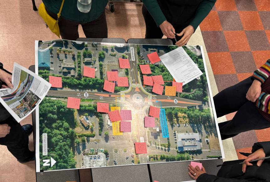 <p>Molly Hetherwick/Kitsap News Group</p>
                                <p>Community members discuss a proposed roundabout project at the intersection of Hwy 305 and High School Road during an open house Feb. 11.</p>
