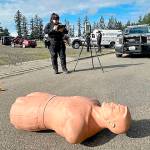 Mike De Felice/Kitsap News Group photos
Bremerton Police Department traffic officer Jacynda Espinosa works a mock car accident scene that utilizes a dummy as the struck pedestrian.