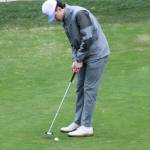 Spartan Samuel Hodus strokes a putt in a 155-208 Bainbridge victory over Olympic March 12 at Kitsap Golf & Country Club in Bremerton.