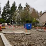 The parking lot will include eight rain gardens.